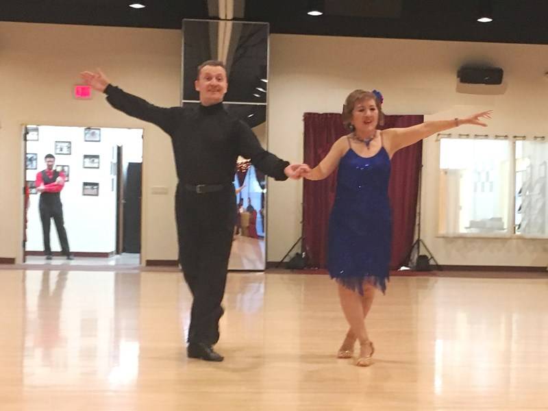 Denis dancing ChaCha with student Tina at Holiday Dance Showcase